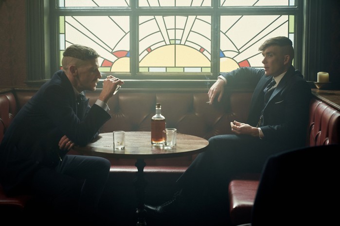 Tommy and Arthur Shelby drinking