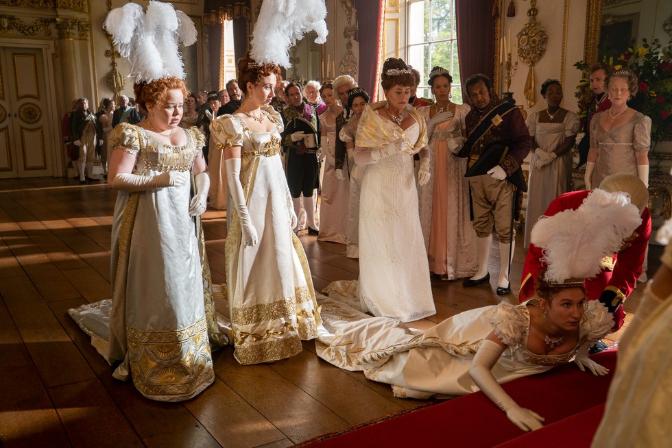 The Featherington sisters (played by Nichola Coughlan, Harriet Cains and Polly Walker) curtsey to Queen Charlotte in Netflix series ‘Bridgerton’ as part of their debutante debut. (Photo by LIAM DANIEL/NETFLIX © 2020)