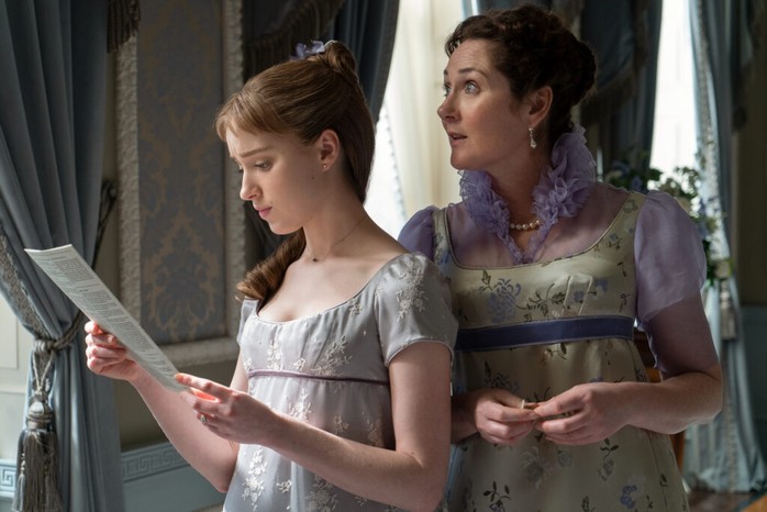 Phoebe Dynevor as Daphne Bridgerton and Ruth Gemmell as Lady Violet Bridgerton, read Lady Whistledown's Society Papers in an episode of Bridgerton