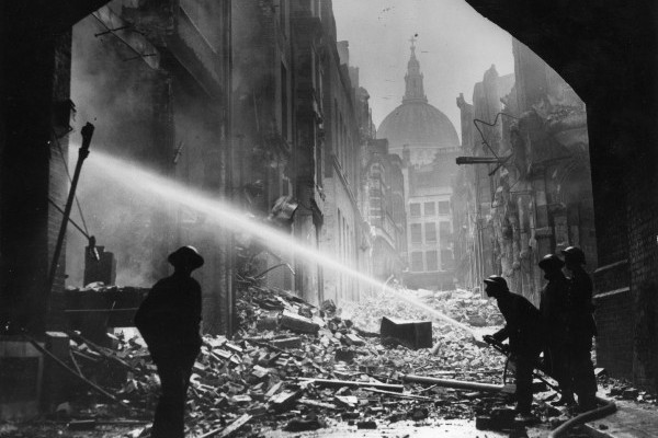 Firemen tackling a blitz fire at St Paul's Cathedral, London