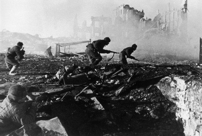 1941: Red Army troops storming an apartment block amidst the ruins of war-torn Stalingrad during World War II. (Photo by Georgi Zelma/Slava Katamidze Collection/Getty Images)