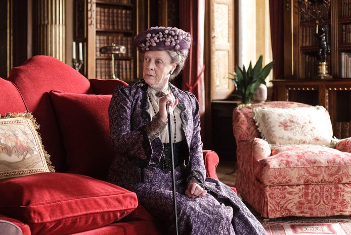 Actor Maggie Smith in a purple Edwardian gown,, as Dowager Lady Grantham