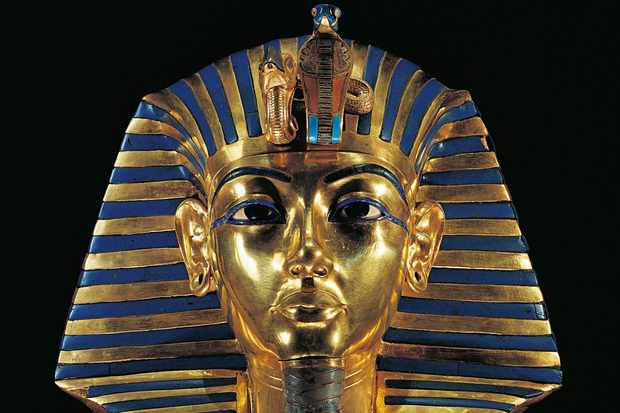 Golden funerary mask of Tutankhamun, inlaid with lapis lazuli, obsidian and turquoise. (Photo By DEA / G. DAGLI ORTI/De Agostini/Getty Images)