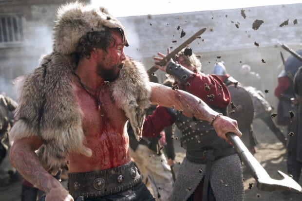 Harald Sigurdson fights barechested with a bearskin on his shoulders in Vikings Valhalla
